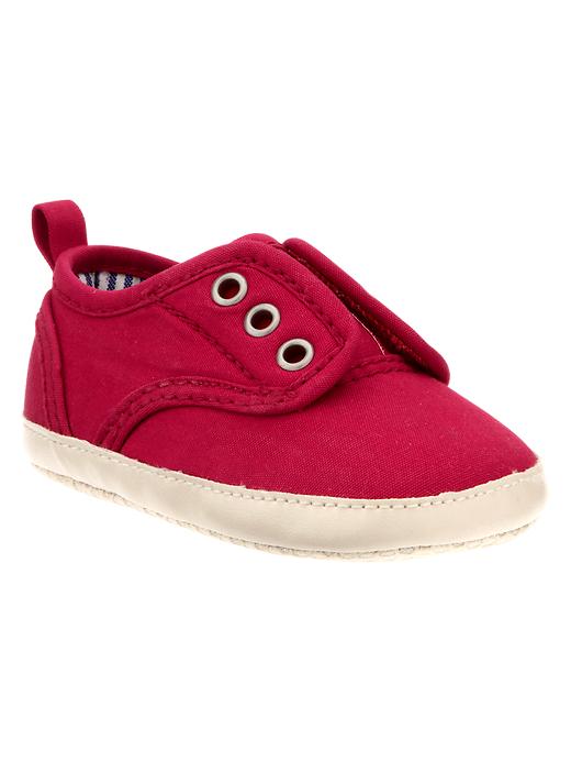 View large product image 1 of 3. Red canvas slip-on sneakers