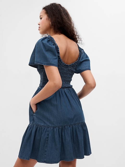 Image number 2 showing, Flutter Sleeve Smocked Denim Mini Dress