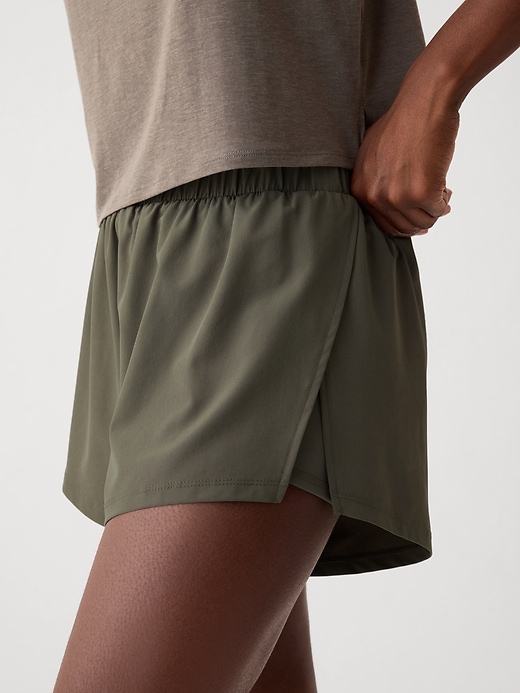 Image number 4 showing, GapFit Mid Rise Dolphin Running Shorts