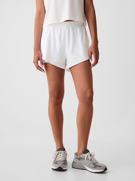 Image number 1 showing, GapFit Mid Rise Dolphin Running Shorts
