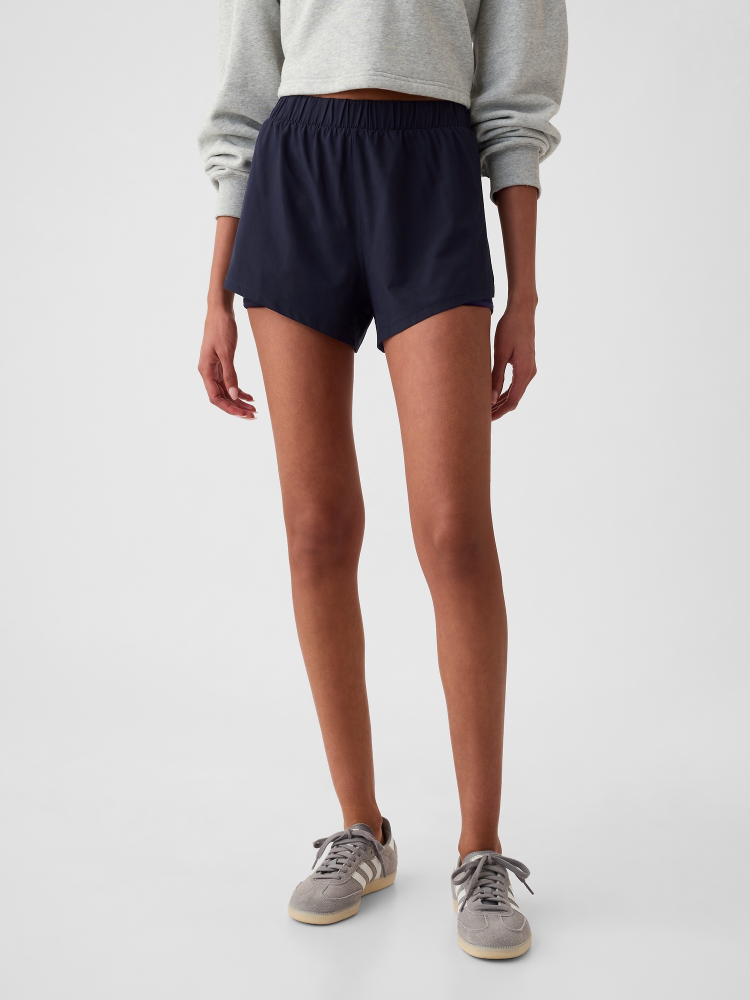 Shop Gap Fit Mid Rise Dolphin Running Shorts In Navy Blue